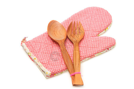 木制勺子和叉子配有被切割的热防护手图片