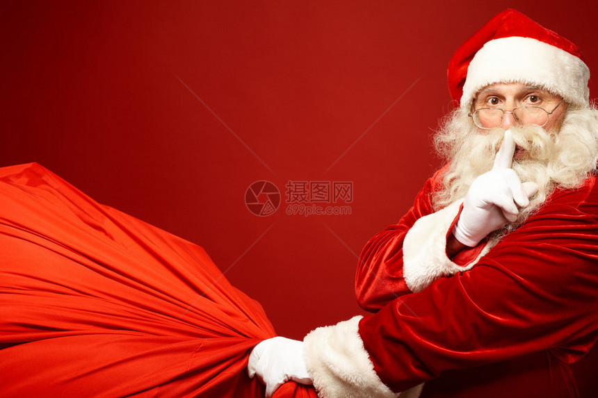 圣誕老人的肖像用巨大的红色麻袋在他嘴边留着食人者图片