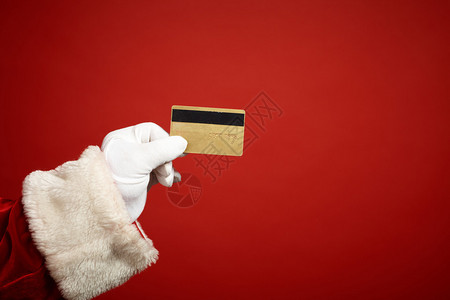 圣诞老人戴手套持红色图片