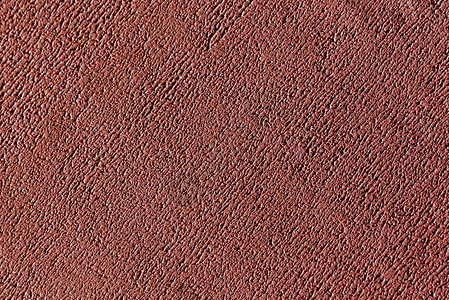 红色的石膏墙表面抽象的背景和设计纹理图片