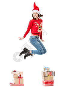 穿着圣诞节毛衣的跳女青年带着一堆白色图片