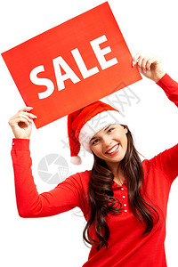 圣诞老人帽子的快乐女孩拿着有售图片