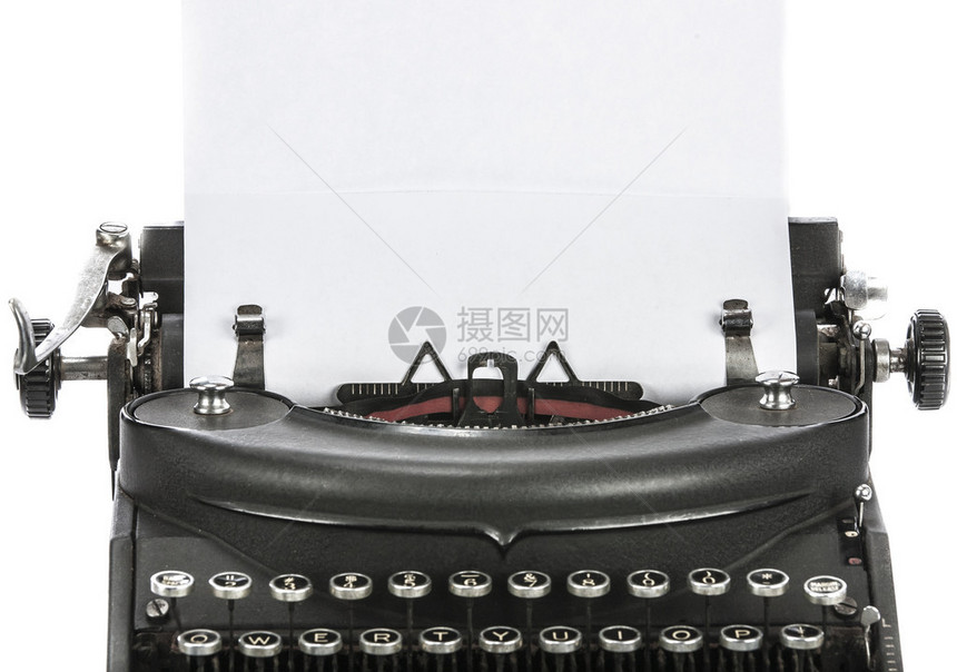 在白色背景上孤立的老式旧打字机图片