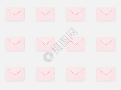 粉红色邮件信封的重复图案背景图片