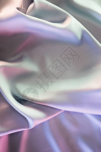 绿色和紫色光泽缎面织物背景背景图片