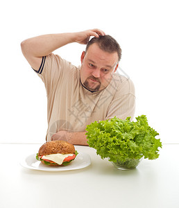 超重男子挠头的艰难饮食选择概念图片