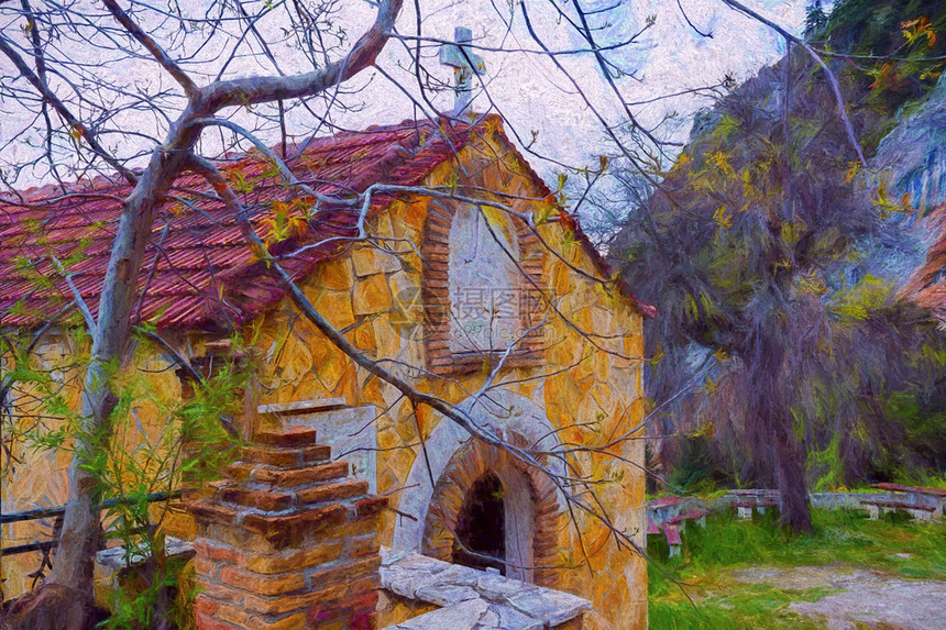 山上带有树木的希腊农村教堂图片