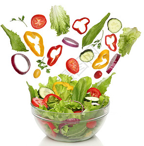 新鲜蔬菜掉落分离的健康沙拉图片