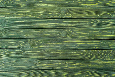 在绿色背景绘的木水平板条图片