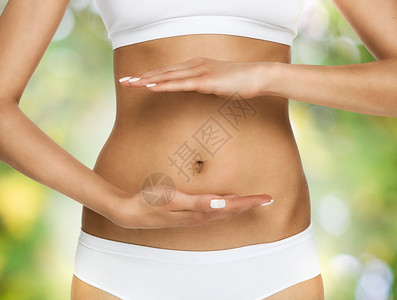 怀孕或饮食概念女手保护对自然的胃图片
