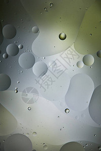 浅绿色和灰色混合水和油的创意抽象背景图片