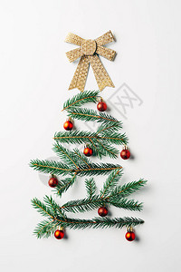 绿色松树枝的顶部视图装饰为节日圣诞树背景图片