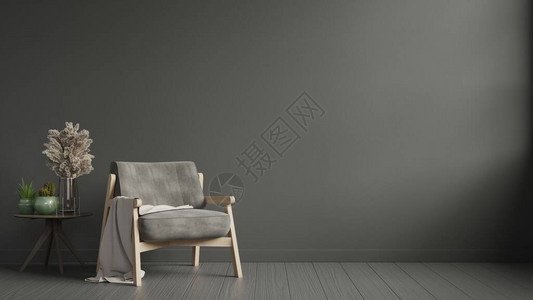 柳条筐内地有一张坐椅在黑暗的黑墙背景上设计图片