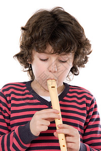可爱的孩子玩长笛在超过白背图片