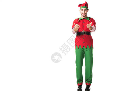 穿着圣诞精灵服装微笑的男人用伸展的手姿势图片