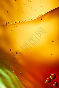 橙色红色和绿色混合水和油的背景图片