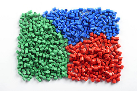 模压由回收废物制成的模制塑料颗粒或颗粒的彩色收集背景