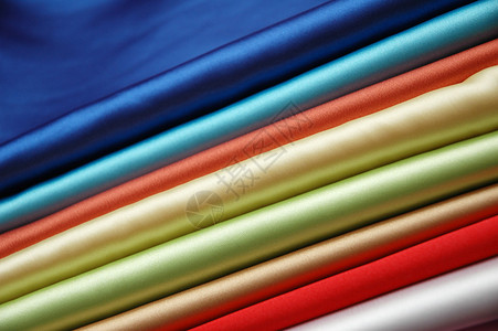 堆各种样的颜色缎织品图片