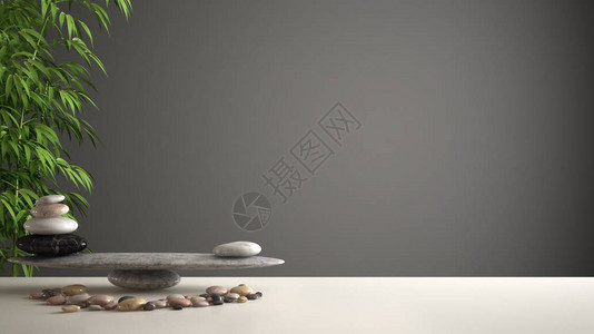 空室内设计风水概念zen想法白桌或有石子平衡的架子和绿竹背景图片