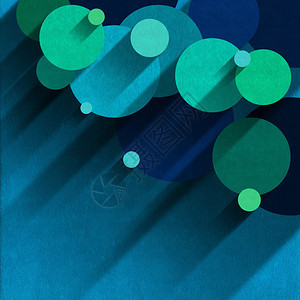 蓝色和绿色的天鹅绒圆圈在有阴影的浅蓝色图片