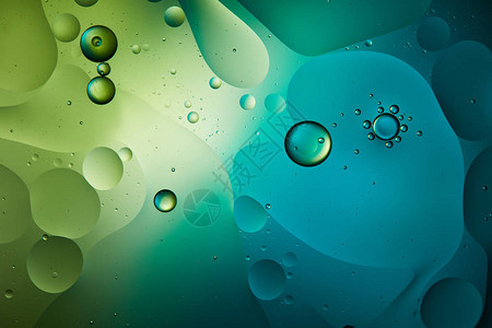 蓝色和绿色混合水和油的抽象背景图片