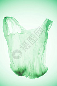 绿色调光下的空透明塑料袋图片