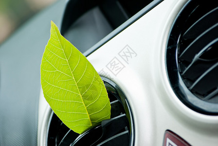 汽车空气出口的绿叶清洁空调的概背景图片