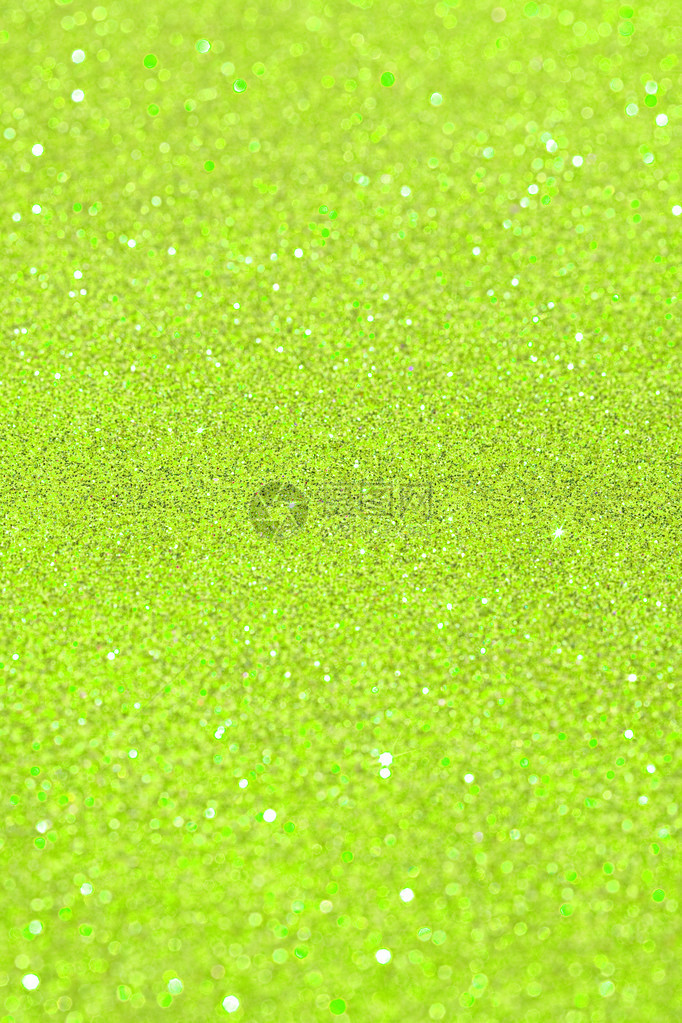 抽象的绿色闪光节日背景纹理与闪亮的闪光星全帧酸黄色圣诞细节与模糊区域艺术彩色图片