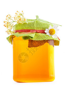 蜂蜜在玻璃罐中花朵与图片