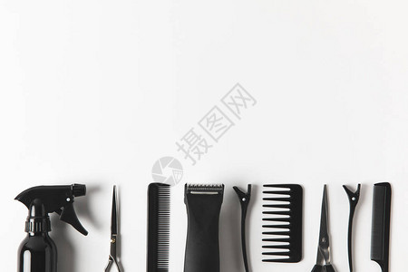 排成一排的理发剪和美发工具的顶部视图背景图片