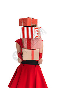 女在圣诞节礼物上拿着堆叠的模糊视线图片