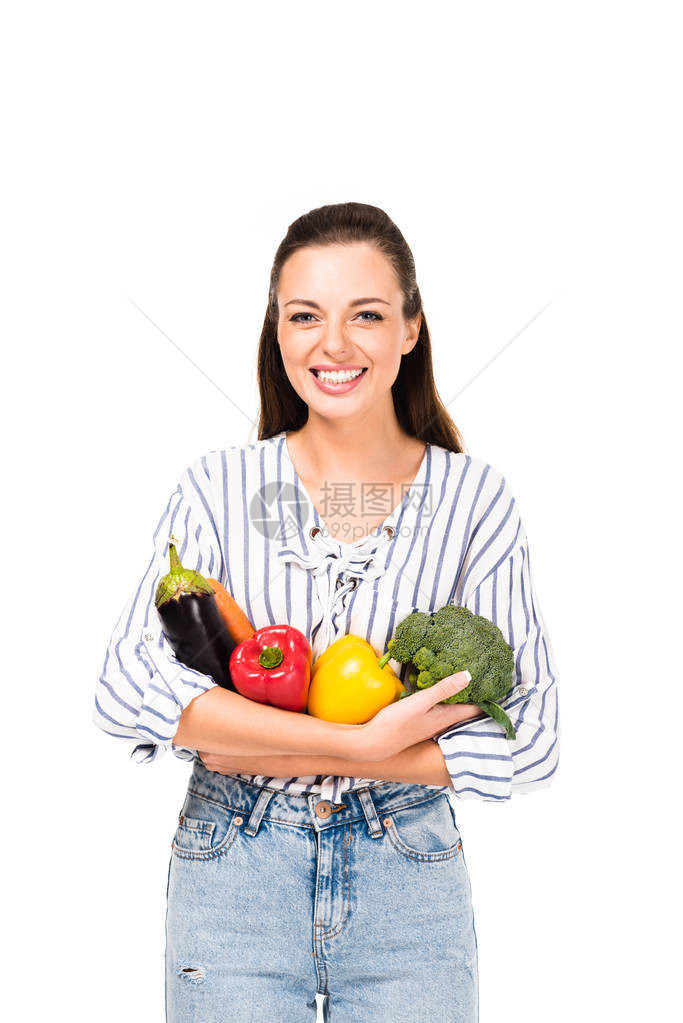 带着各种新鲜蔬菜的笑容女肖像白色上隔图片