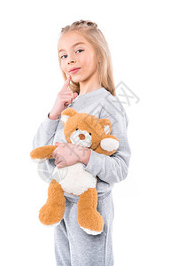 可爱的小女孩抱着泰迪熊微笑着图片