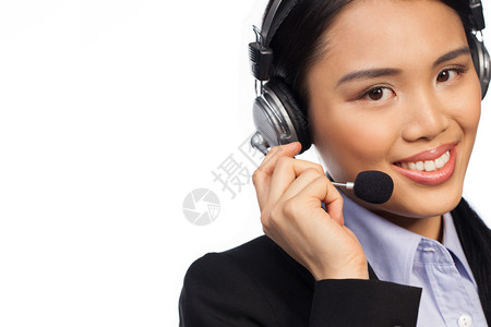 手戴耳盔和时式商务夹克呼叫中心概念服务台或接待员的图片