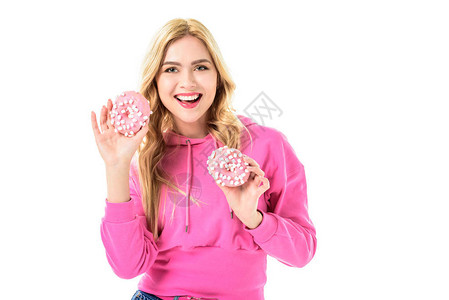 年轻女孩拿着粉红甜圈背景图片