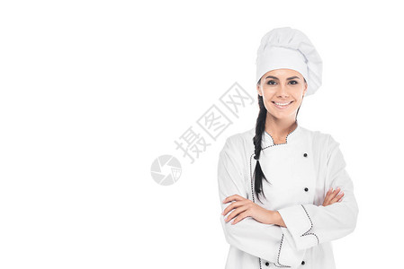 戴着帽子微笑的厨师站着手持十字臂图片