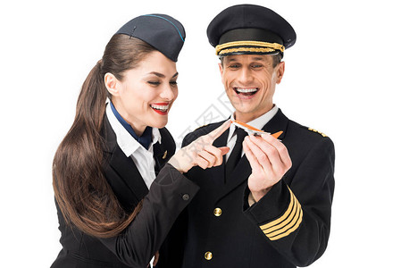 年轻空姐和驾驶员将玩具飞图片