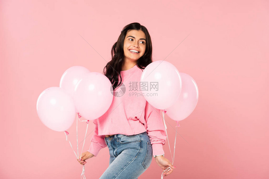 带着粉色气球的美丽快乐女孩图片