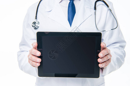 男医生持有数字平板电脑的中部片段白面图片