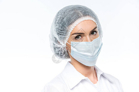 戴医疗面具和帽子的女医生图片