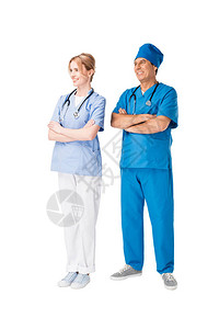 外科医生和护士的双臂折叠在白图片