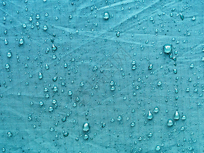 防水帐篷材料上有很多雨滴图片