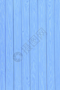 在蓝色背景绘的木垂直板条图片