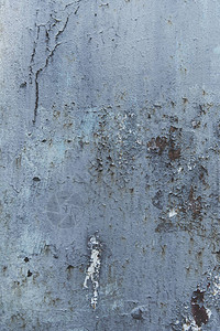 蓝色划痕粗糙墙壁纹理的特写视图图片