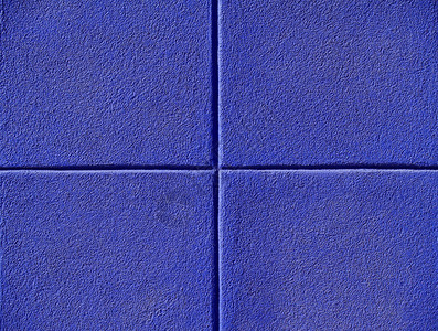 混凝土墙上四个蓝色方块电源点背背景图片