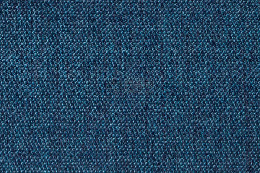 从羊毛纹理纺织缝合的海军蓝底背景图片