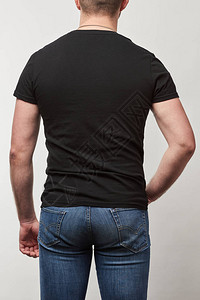 黑色T恤衫上的人背面灰色上背景图片