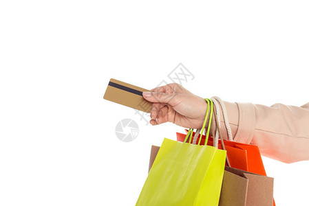 妇女持有购物袋和信用卡孤立在白色上的妇图片
