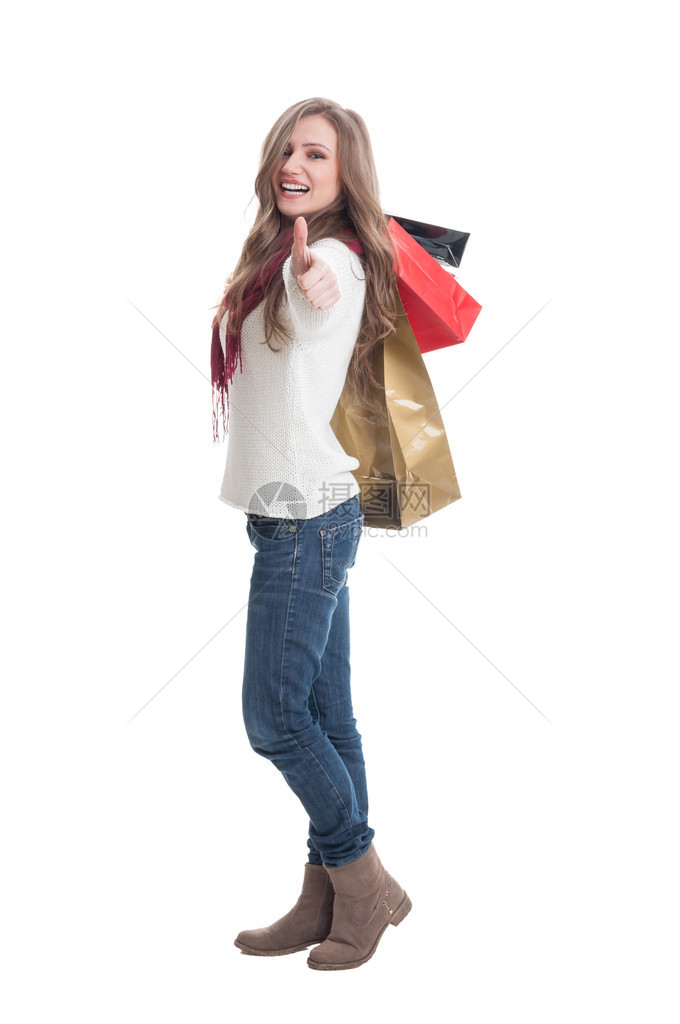 购物女孩举起大拇指在肩膀图片
