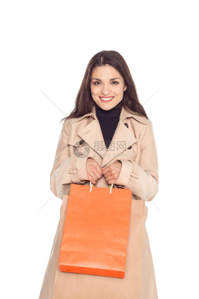 美女拿着购物袋在白图片